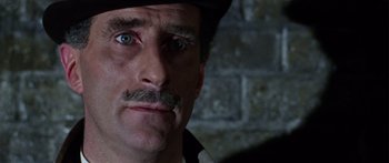 Movie still from “The Ipcress File” (1965), directed by Sidney J. Furie – A person wearing a hat; Close Up shot, High angle