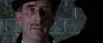 Movie still from “The Ipcress File” (1965), directed by Sidney J. Furie – A person wearing a hat; Close Up shot, High angle