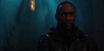 Movie still from “Altered Carbon” (2018), created by Laeta Kalogridis – A man in a leather jacket is looking at the camera; Close Up shot, Low angle