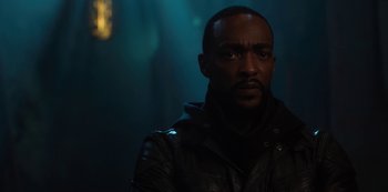 Movie still from “Altered Carbon” (2018), created by Laeta Kalogridis – A man wearing a leather jacket in a dark room; Close Up shot, Low angle