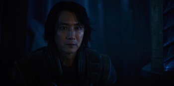 Movie still from “Altered Carbon” (2018), created by Laeta Kalogridis – A person with long black hair; Close Up shot, Over the shoulder angle