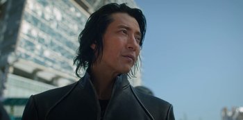 Movie still from “Altered Carbon” (2018), created by Laeta Kalogridis – A person with long hair; Close Up shot, Low angle