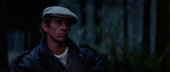 Movie still from “The Keep” (1983), directed by Michael Mann – A person wearing a hat; Close Up shot, Over the shoulder angle