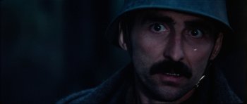 Movie still from “The Keep” (1983), directed by Michael Mann – A person wearing a hat; Close Up shot, Low angle