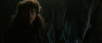 Movie still from “The Keep” (1983), directed by Michael Mann – A person wearing a jacket; Close Up shot, Over the shoulder angle