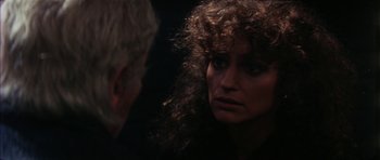Movie still from “The Keep” (1983), directed by Michael Mann – A man and a woman looking at one another; Close Up shot, Over the shoulder angle