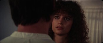 Movie still from “The Keep” (1983), directed by Michael Mann – A person looking at a mirror; Close Up shot, Over the shoulder angle