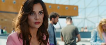 Movie still from “The Key Game” (2022), directed by Vicente Villanueva – A person wearing a pink shirt; Close Up shot, Over the shoulder angle