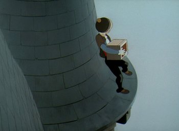 Movie still from “The King and the Mockingbird” (1980), directed by Paul Grimault – A person holding a box on top of a building; Wide shot, Overhead angle