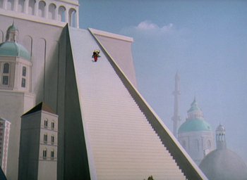 Movie still from “The King and the Mockingbird” (1980), directed by Paul Grimault – A man riding a snowboard down the side of an escalator; Extreme Wide shot, Low angle
