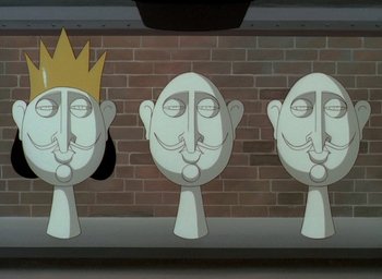 Movie still from “The King and the Mockingbird” (1980), directed by Paul Grimault – A group of three cartoon heads that are on a wall; Close Up shot, Low angle