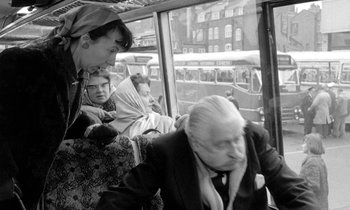 Movie still from “The Knack... and How to Get It” (1965), directed by Richard Lester – An older woman sitting on a bus next to a young man; Medium shot, Over the shoulder angle