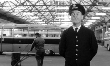 Movie still from “The Knack... and How to Get It” (1965), directed by Richard Lester – An old photo of a man in a uniform and a hat; Medium shot, Low angle