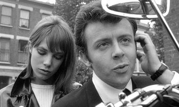 Movie still from “The Knack... and How to Get It” (1965), directed by Richard Lester – A man and a woman standing next to each other in front of a building; Close Up shot, Low angle