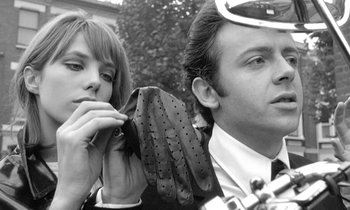 Movie still from “The Knack... and How to Get It” (1965), directed by Richard Lester – A man and a woman standing next to each other; Close Up shot, Low angle