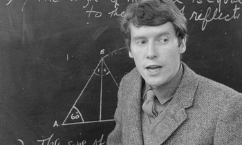 Movie still from “The Knack... and How to Get It” (1965), directed by Richard Lester – Black and white photograph of a man in front of a chalkboard; Close Up shot, Overhead angle