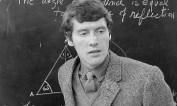 Movie still from “The Knack... and How to Get It” (1965), directed by Richard Lester – Black and white photograph of a man in front of a chalkboard; Close Up shot, High angle