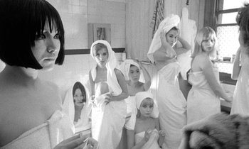 Movie still from “The Knack... and How to Get It” (1965), directed by Richard Lester – A group of women wrapped in towels in a bathroom; Medium shot, Low angle