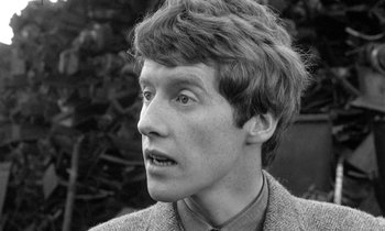 Movie still from “The Knack... and How to Get It” (1965), directed by Richard Lester – A young man with short brown hair wearing a jacket; Close Up shot, High angle