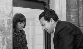 Movie still from “The Knack... and How to Get It” (1965), directed by Richard Lester – A man and a woman standing next to each other; Medium shot, Over the shoulder angle