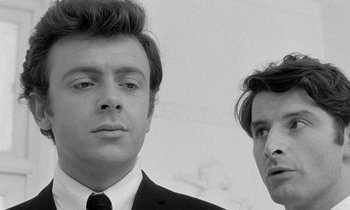 Movie still from “The Knack... and How to Get It” (1965), directed by Richard Lester – A black and white photo of two men in suits; Close Up shot, Low angle