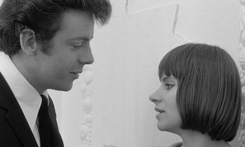 Movie still from “The Knack... and How to Get It” (1965), directed by Richard Lester – A man and a woman looking at each other; Close Up shot, Over the shoulder angle