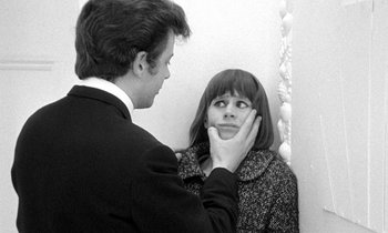Movie still from “The Knack... and How to Get It” (1965), directed by Richard Lester – A young woman looking in the mirror while a man looks at her face; Close Up shot, Over the shoulder angle