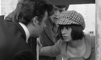 Movie still from “The Knack... and How to Get It” (1965), directed by Richard Lester – A man and a woman talking to another man in front of another man; Close Up shot, Over the shoulder angle