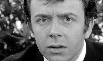 Movie still from “The Knack... and How to Get It” (1965), directed by Richard Lester – Black and white photograph of a man looking at the camera; Close Up shot, Over the shoulder angle