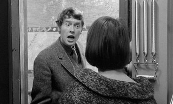 Movie still from “The Knack... and How to Get It” (1965), directed by Richard Lester – A black and white photo of a man and a woman; Medium shot, Over the shoulder angle