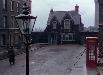 Movie still from “The Ladykillers” (1955), directed by Alexander Mackendrick – A street light in front of a large house; Extreme Wide shot, High angle