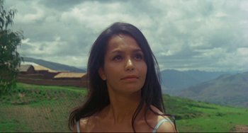 Movie still from “The Last Movie” (1971), directed by Dennis Hopper – A beautiful young woman with long black hair; Close Up shot, Low angle