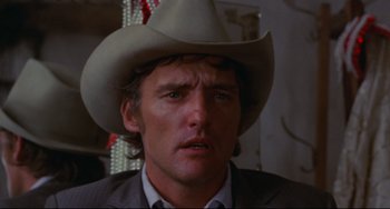 Movie still from “The Last Movie” (1971), directed by Dennis Hopper – A person wearing a cowboy hat; Close Up shot, Low angle