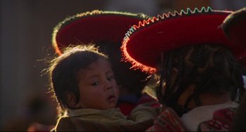Movie still from “The Last Movie” (1971), directed by Dennis Hopper – A young child wearing a large sombrero; Extreme Close Up shot, High angle