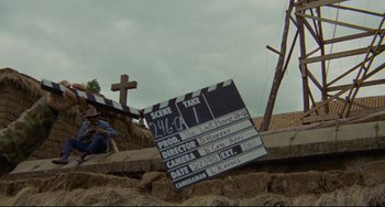 Movie still from “The Last Movie” (1971), directed by Dennis Hopper – A film slate sitting on top of a pile of rocks; Wide shot, Low angle