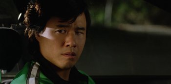 Movie still from “Always Be My Maybe” (2019), directed by Nahnatchka Khan – A person wearing a green shirt; Close Up shot, Over the shoulder angle