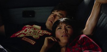 Movie still from “Always Be My Maybe” (2019), directed by Nahnatchka Khan – A man and a woman sitting next to each other in the back of a car; Close Up shot, Overhead angle