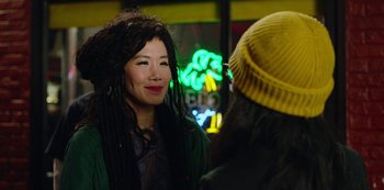 Movie still from “Always Be My Maybe” (2019), directed by Nahnatchka Khan – A woman wearing a green jacket is talking to another woman; Close Up shot, Over the shoulder angle