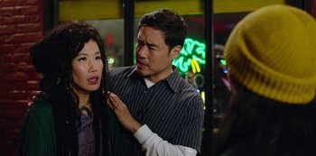 Movie still from “Always Be My Maybe” (2019), directed by Nahnatchka Khan – A man and a woman in front of a building; Close Up shot, Over the shoulder angle