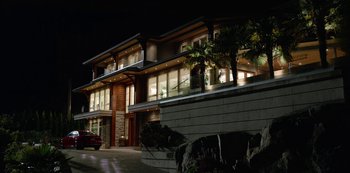 Movie still from “Always Be My Maybe” (2019), directed by Nahnatchka Khan – A building that has a car parked in front of it at night; Extreme Wide shot, Low angle