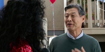 Movie still from “Always Be My Maybe” (2019), directed by Nahnatchka Khan – An older man talking to an older woman outside; Close Up shot, Over the shoulder angle