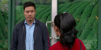 Movie still from “Always Be My Maybe” (2019), directed by Nahnatchka Khan – A man and a woman standing next to each other on a train; Close Up shot, Over the shoulder angle