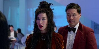 Movie still from “Always Be My Maybe” (2019), directed by Nahnatchka Khan – A man and a woman with dreadlocks in a room; Close Up shot, Over the shoulder angle