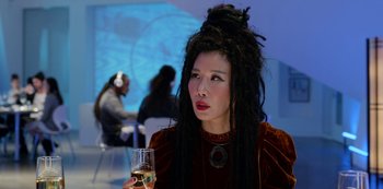 Movie still from “Always Be My Maybe” (2019), directed by Nahnatchka Khan – A woman with dreads holding a glass of wine; Close Up shot, Over the shoulder angle