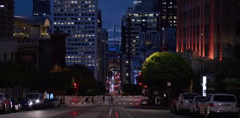 Movie still from “Always Be My Maybe” (2019), directed by Nahnatchka Khan – A city street at night lit up by streetlights; Extreme Wide shot, High angle