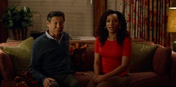 Movie still from “Always Be My Maybe” (2019), directed by Nahnatchka Khan – A man and a woman are sitting on a couch; Medium shot, High angle