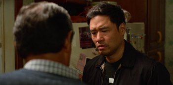 Movie still from “Always Be My Maybe” (2019), directed by Nahnatchka Khan – A man in a black shirt is talking to another man; Close Up shot, Over the shoulder angle