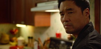 Movie still from “Always Be My Maybe” (2019), directed by Nahnatchka Khan – A person in a kitchen; Close Up shot, Over the shoulder angle