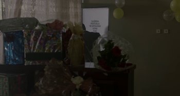 Movie still from “The Load” (2018), directed by Ognjen Glavonic – A bunch of flowers on top of a table; Extreme Close Up shot, Over the shoulder angle