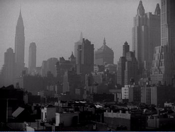 Movie still from “The Lost Weekend” (1945), directed by Billy Wilder – A black - and - white photo of a city skyline; Extreme Wide shot, High angle